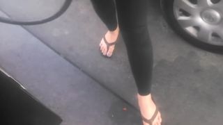 Asian cutie shows her feet at the gasstation