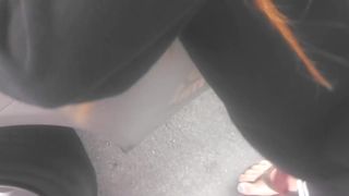 Asian cutie shows her feet at the gasstation