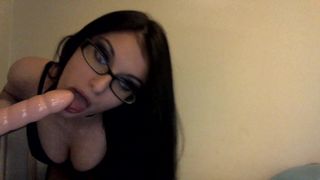 Cute Babe with Glasses blows a Dildo